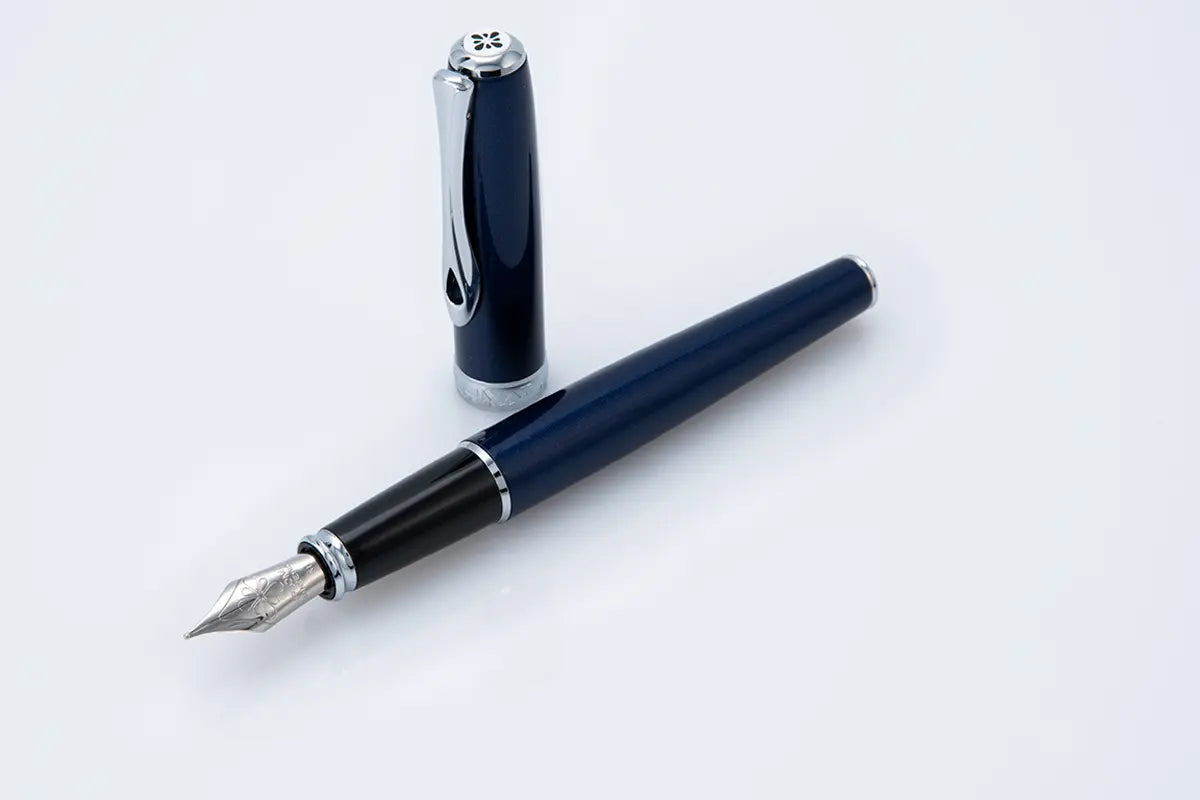 Blue fountain pen on a white background